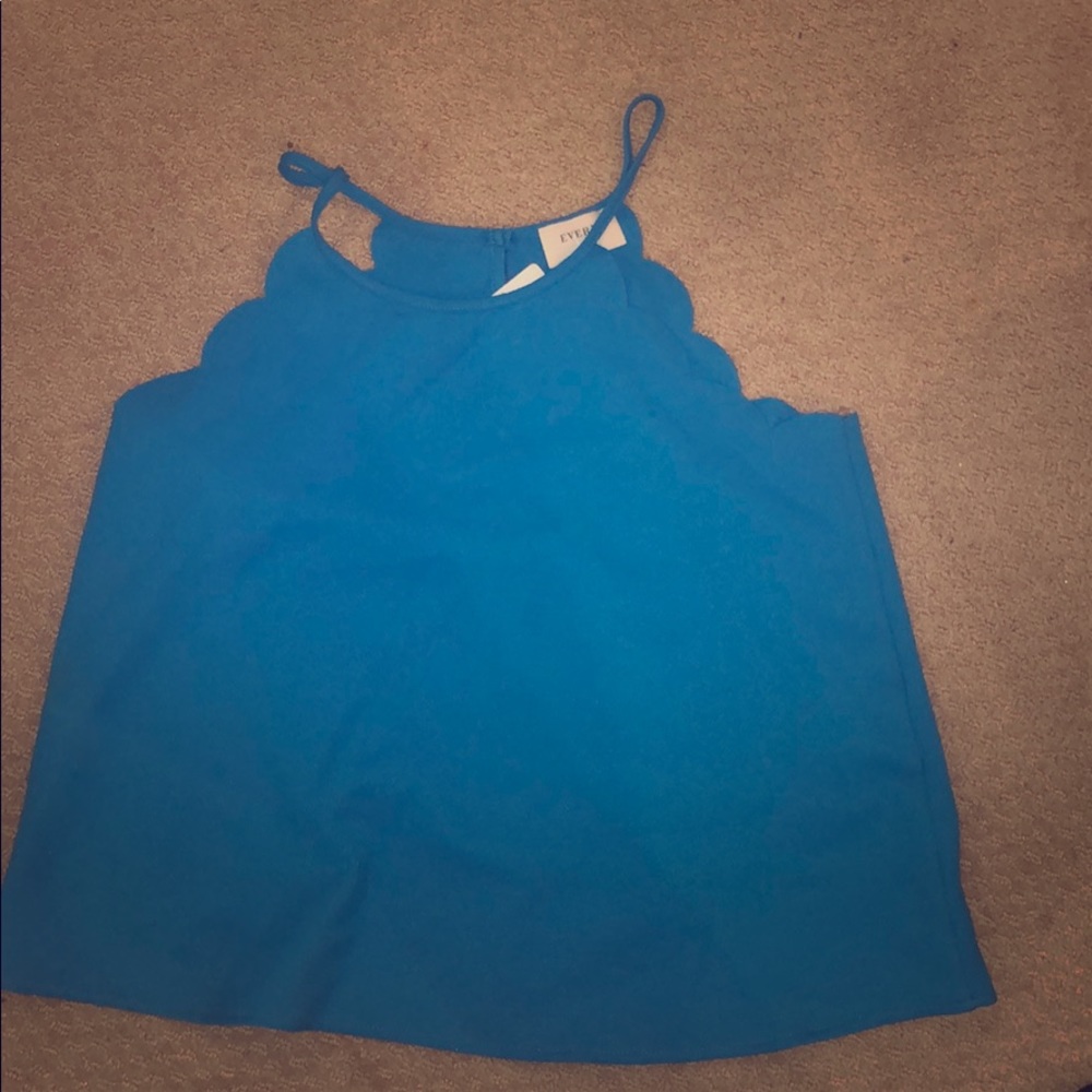 Rich Blue tank with floral cutouts. Never worn.